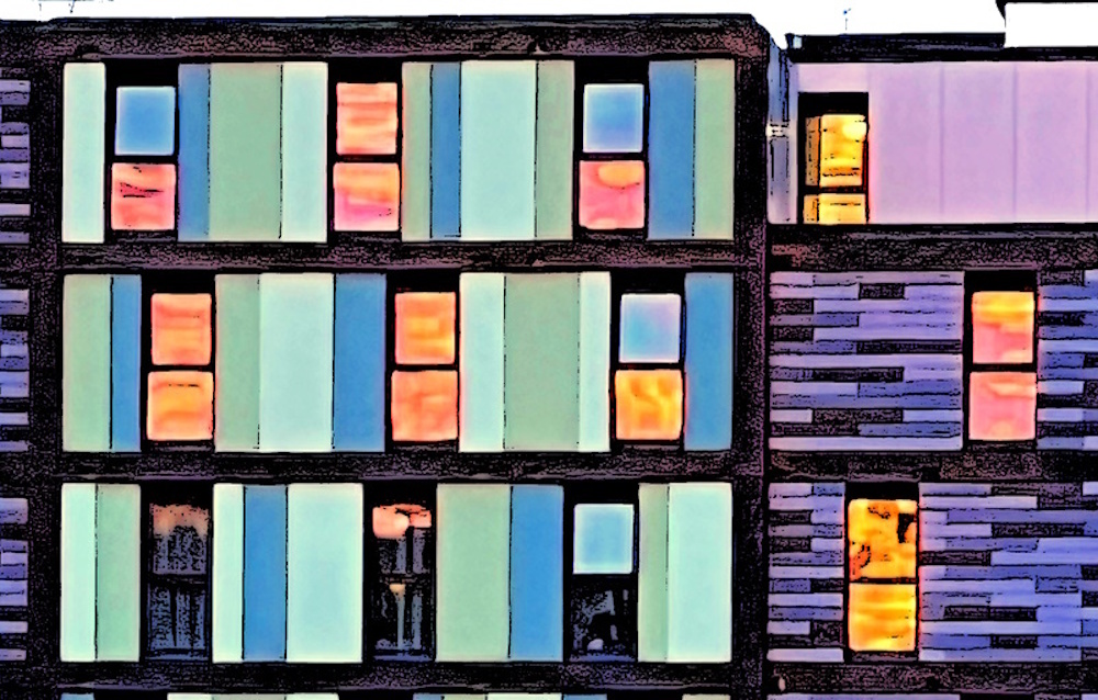 block of flats with sunrise in the windows